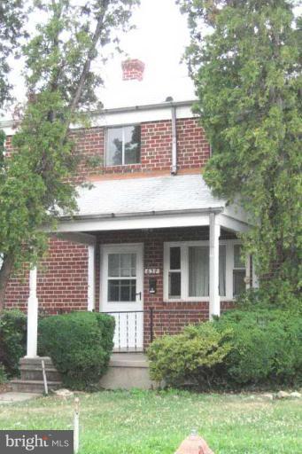 634 Queensgate Road Baltimore, MD 21229 - Photo 1 of 10 a front view of a house with a yard