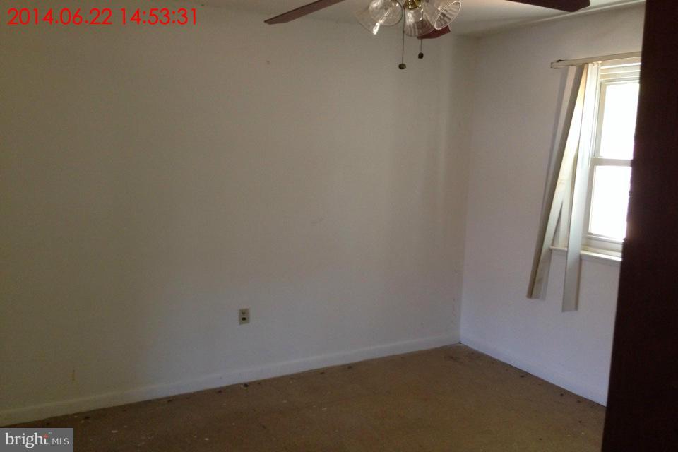 634 Queensgate Road Baltimore, MD 21229 - Photo 5 of 10 a view of a small space with window