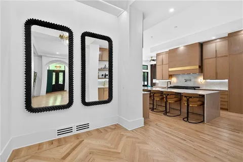 a kitchen with a refrigerator and a stove