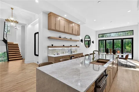 a kitchen with stainless steel appliances granite countertop a refrigerator and cabinets