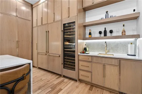 a kitchen with stainless steel appliances granite countertop a sink and a stove