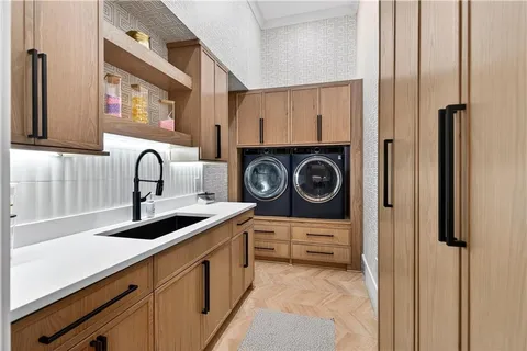 a living room with furniture a window and a flat screen tv