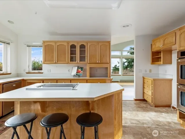 a kitchen with a table and chairs in it