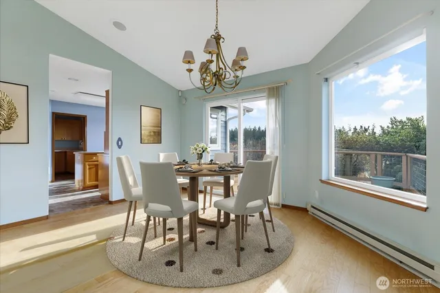a view of a dining room with furniture window and wooden floor