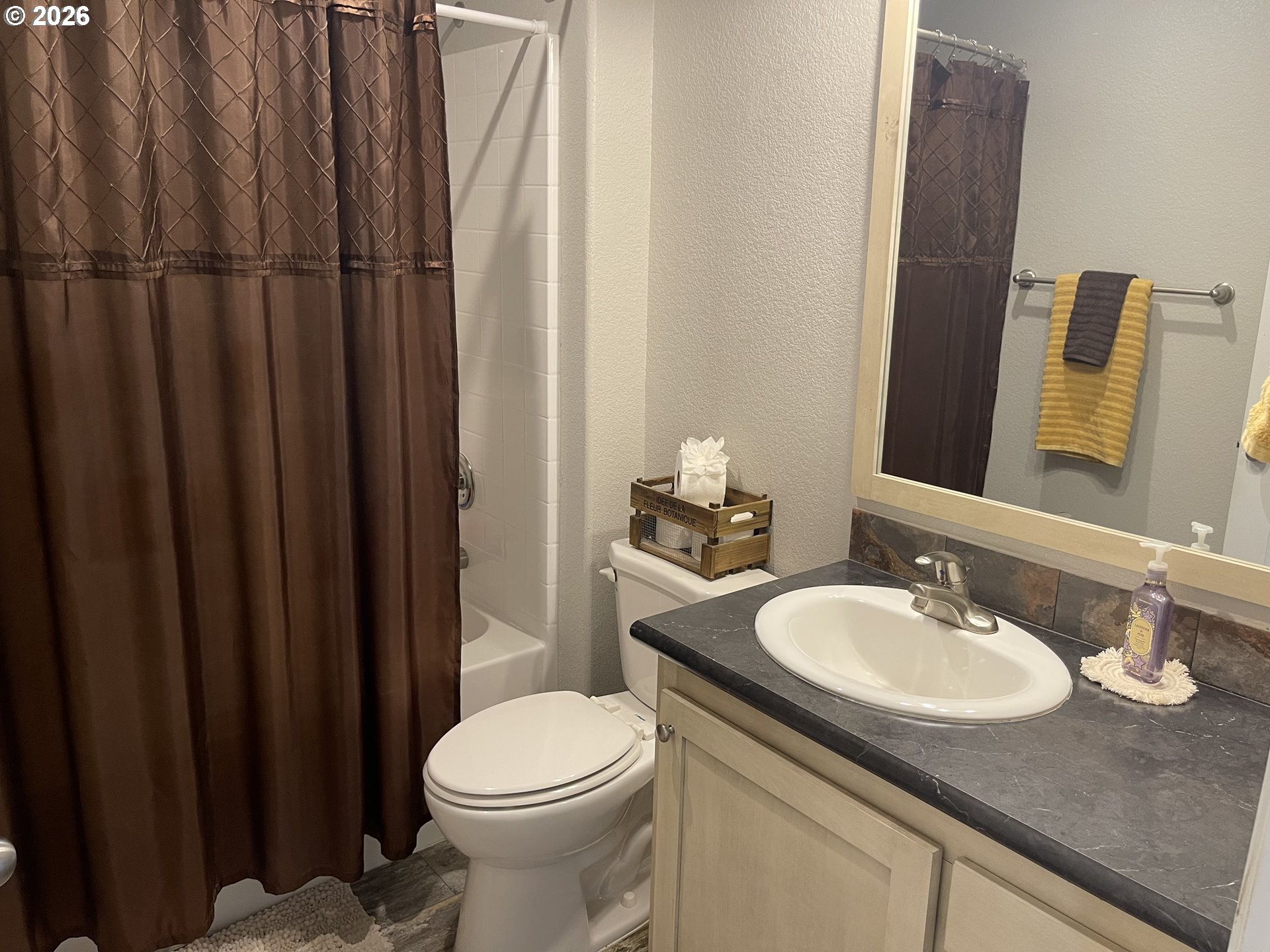 6404 Lookingglass Road Roseburg, OR 97471 - Photo 27 of 48 a bathroom with a granite countertop sink and a mirror