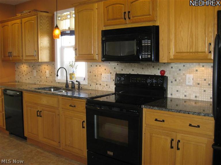 5067 Rootstown Road Ravenna, OH 44266 - Photo 7 of 23 Granite countertops. AWESOME cabinetry.