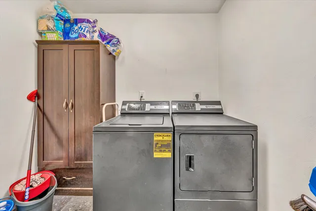 a very nice looking room with a large bed and a chandelier