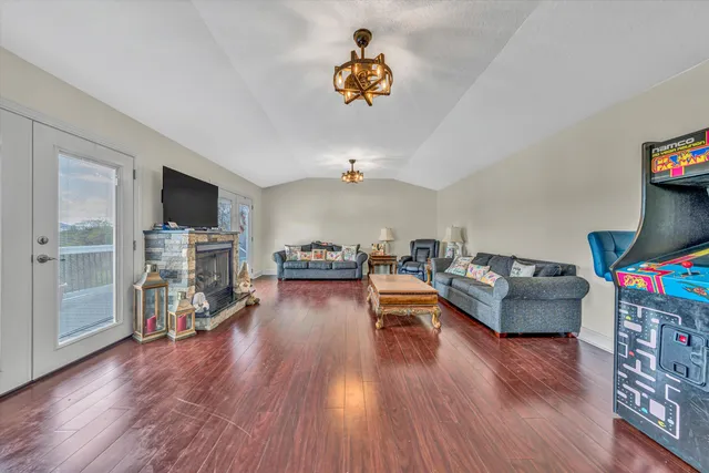 a kitchen with stainless steel appliances a refrigerator sink and microwave