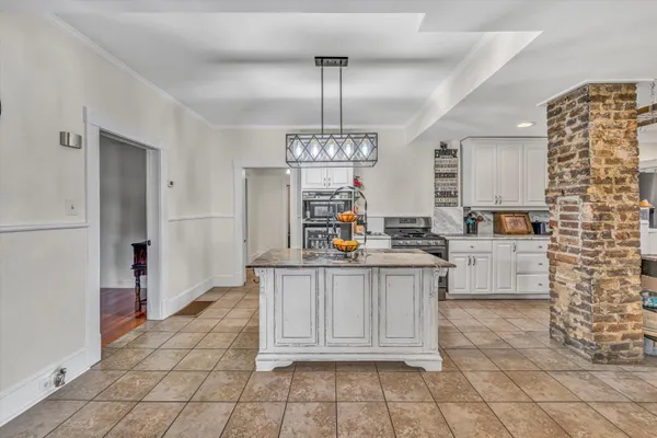 a kitchen with counter top space and appliances