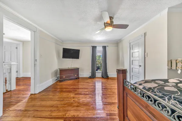 a view of a porch with wooden floor and fence