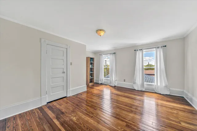 a bathroom with a toilet and a shower curtain