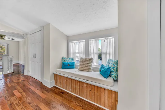 a view of balcony with wooden floor and fence