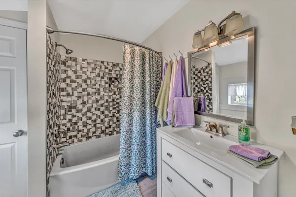 a view of a wooden deck with a table and chairs