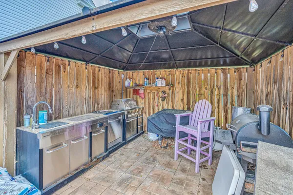 a view of outdoor space with deck and furniture