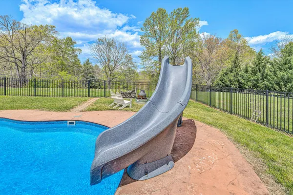 a view of a garden with a house