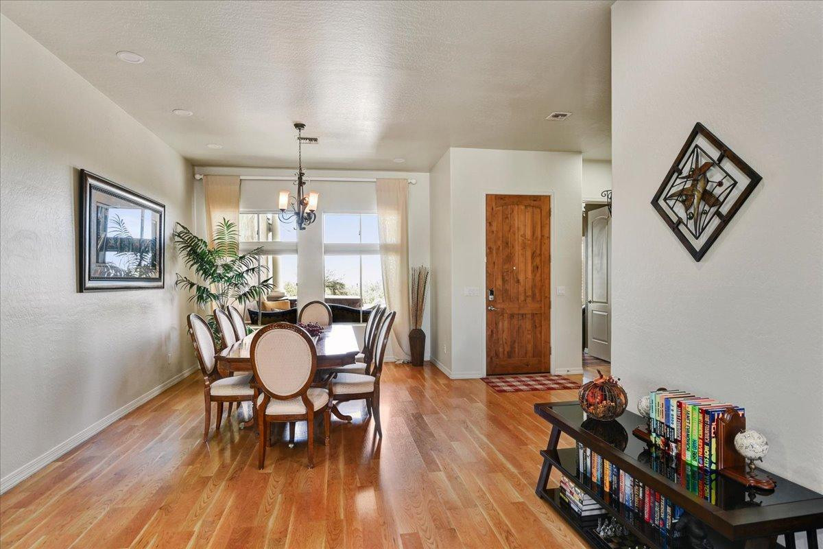 412 East Yearling Road Phoenix, AZ 85085 - Photo 6 of 51 a view of a dining room with furniture and wooden floor