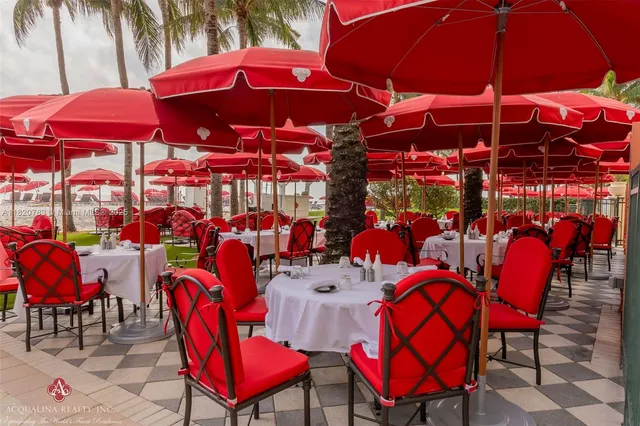 a view of a table and chairs under an umbrella