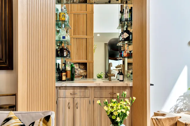 a bathroom with a sink a mirror and a shower