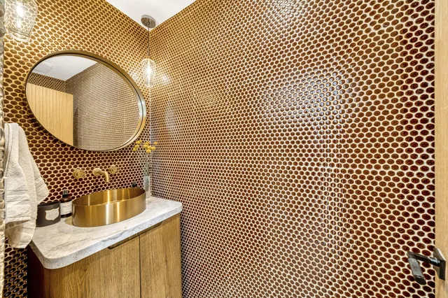 a very nice looking dining room with a table chairs and a refrigerator