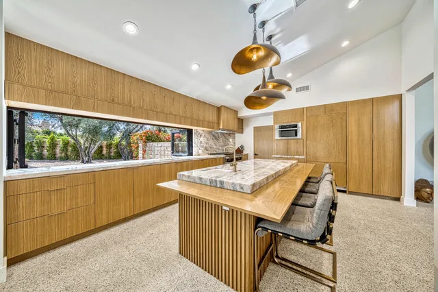 a view of a dining room with furniture window and outside view
