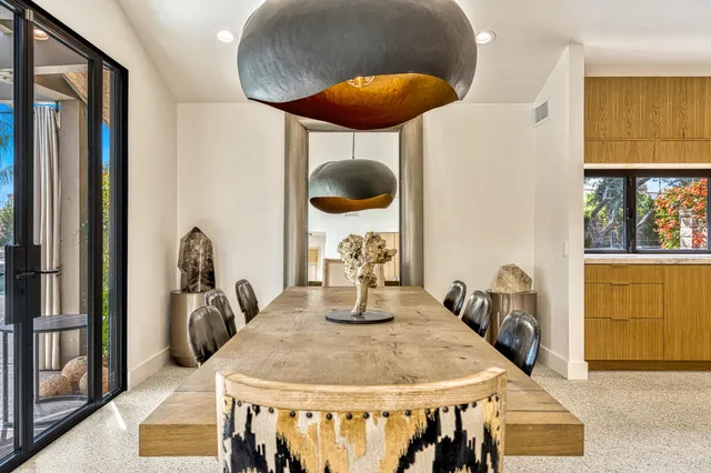 a bedroom with a large bed and a flat screen tv