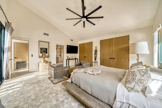a bathroom with a sink and a mirror with toilet