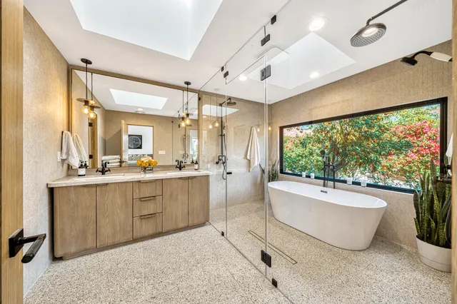 a bedroom with a bed and cabinets