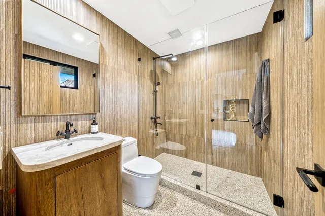 a view of a house with garden and sitting area