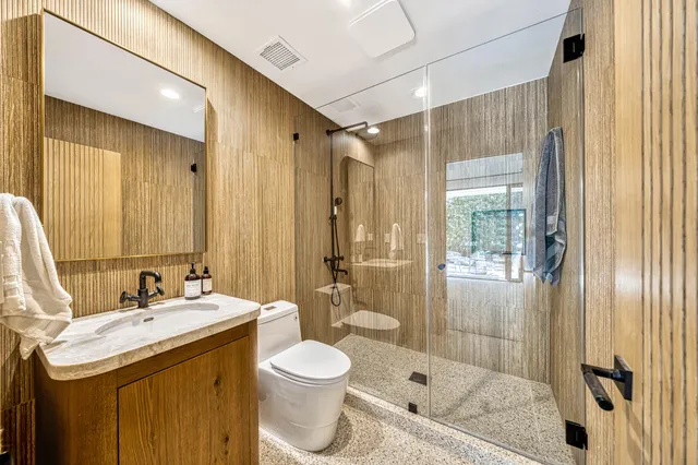 a view of a patio with swimming pool table and chairs