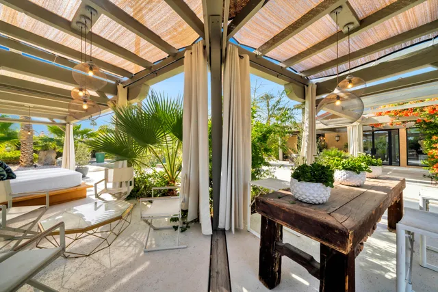 a view of a swimming pool and lounge chairs