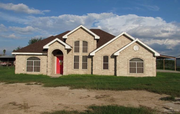 8208 North Doffing Road Mission, TX 78574 - Photo 1 of 1 View of front of home with a front lawn