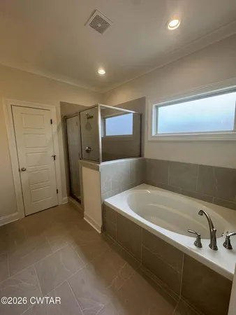 a bathroom with a bathtub and a sink