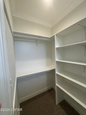 a view of an empty walk in closet