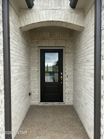 a stone house with a door