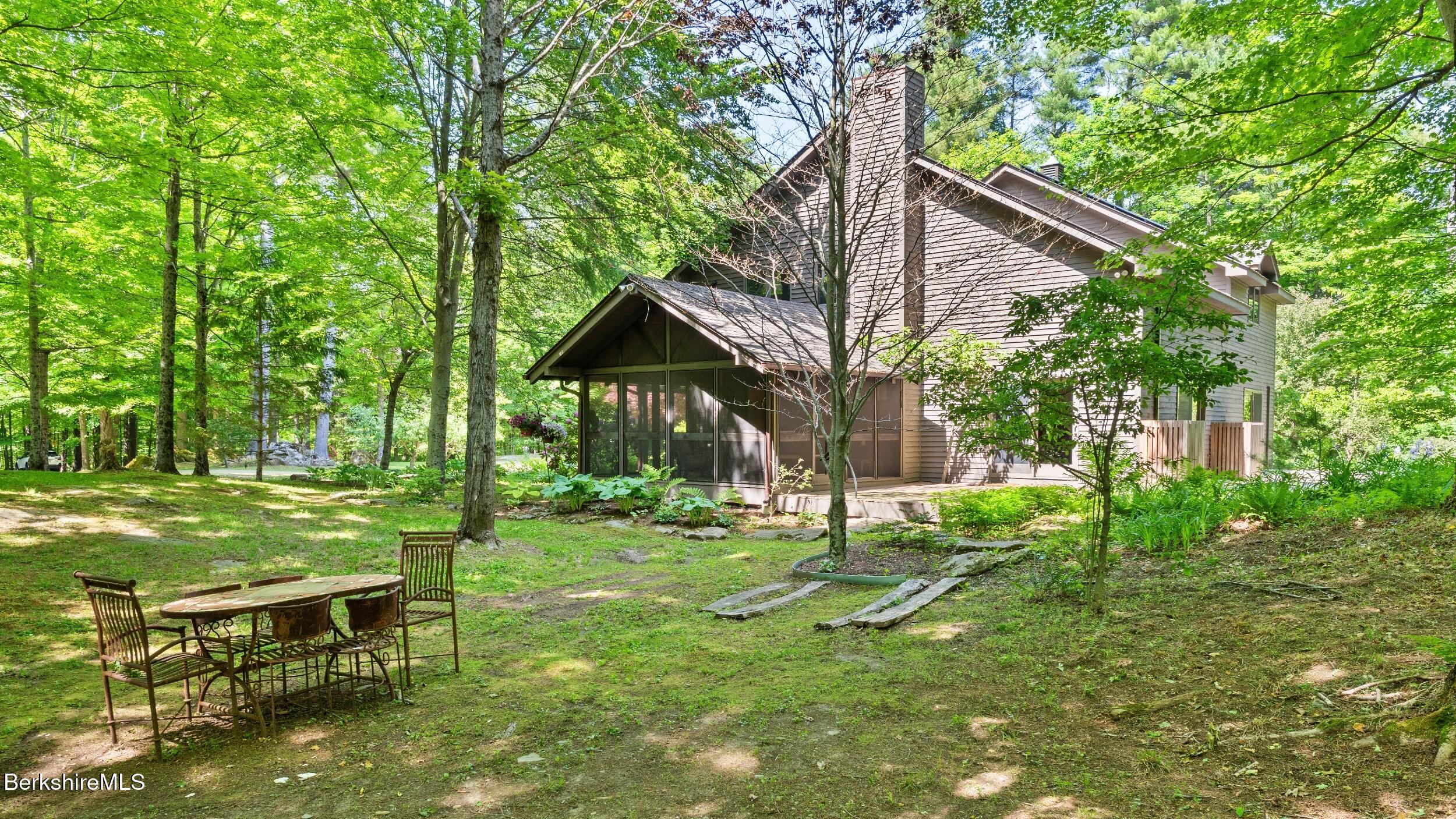173 Hillsdale Road Egremont, MA 01230 - Photo 12 of 82 a backyard of a house with table and chairs