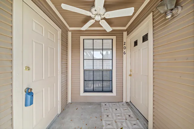 a view of a hallway with windows