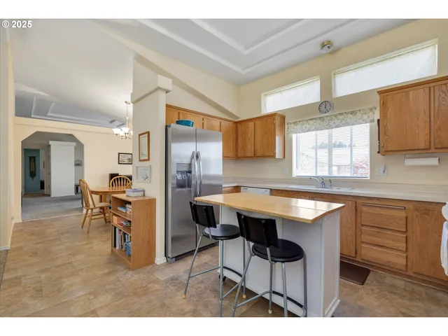 a kitchen with a table and chairs in it