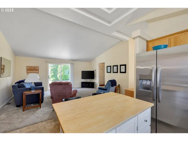 a large bedroom with a large bed and furniture