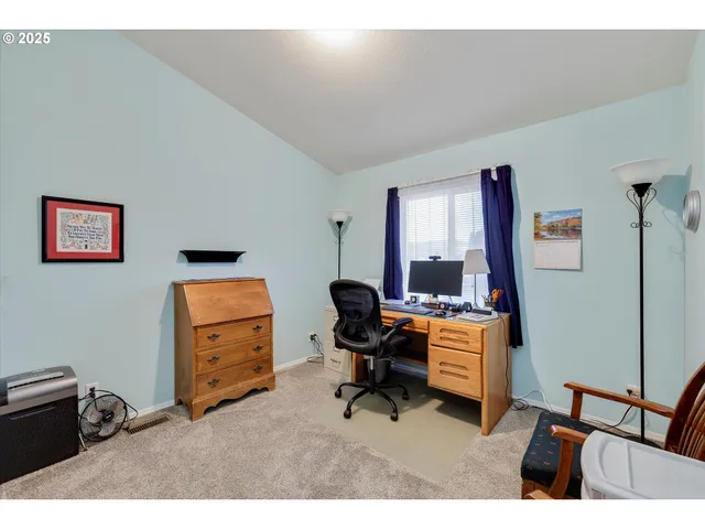 a workspace with furniture and a window