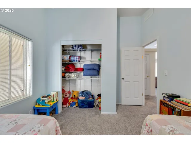 a bedroom with furniture and a window