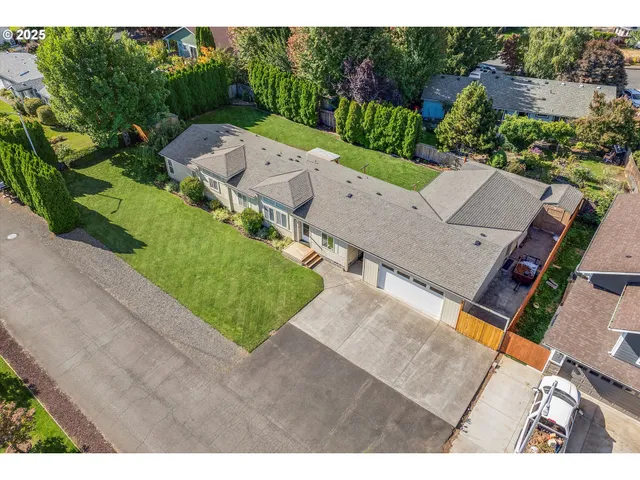 an aerial view of a house with a garden