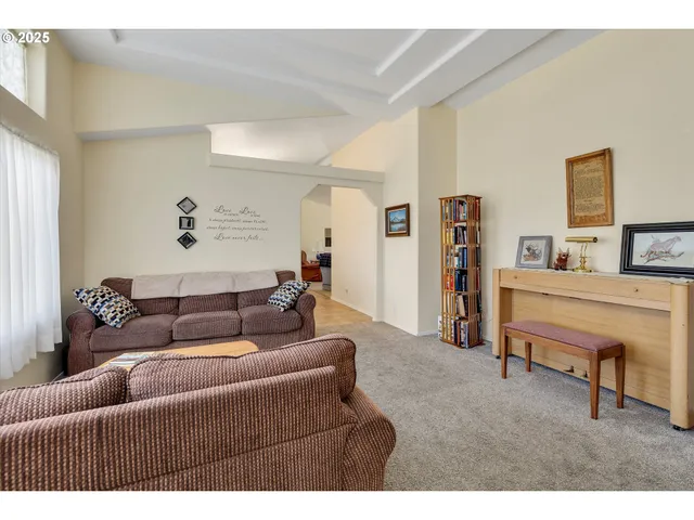 a living room with furniture and a couch