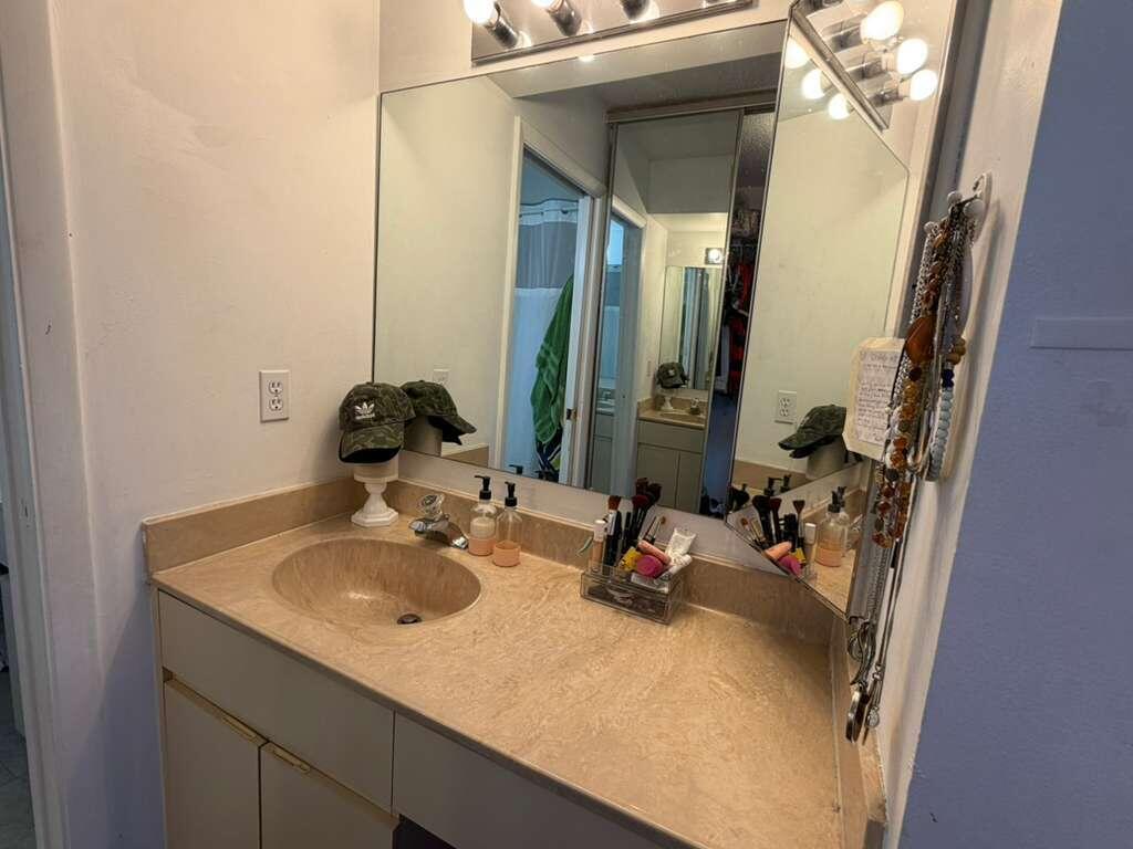 8182 Thames Boulevard, Unit D Boca Raton, FL 33433 - Photo 13 of 20 a bathroom with a sink and mirror