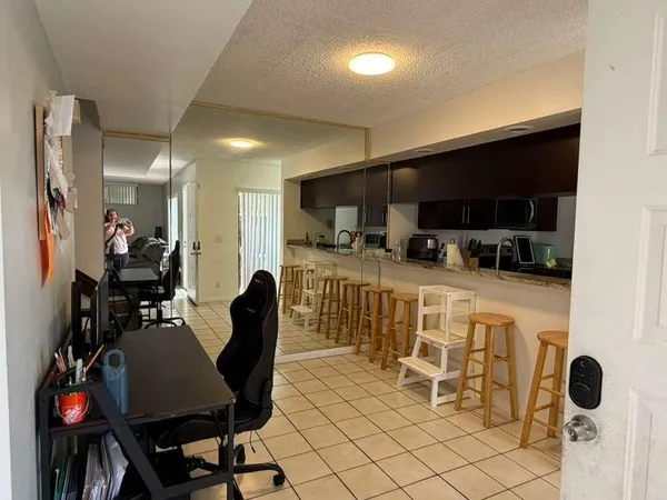 a view of a workspace with furniture