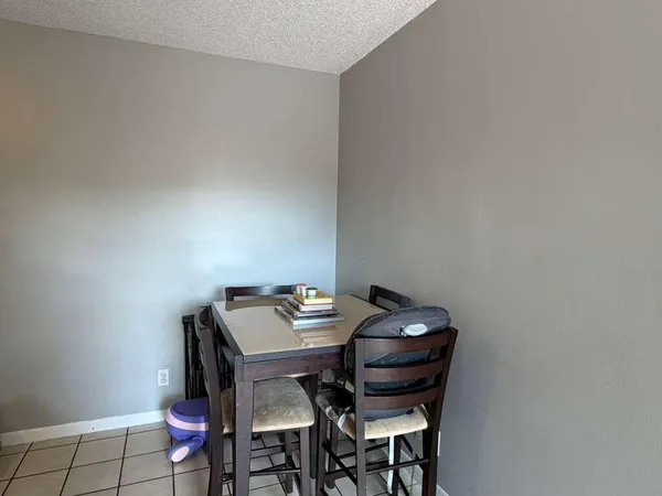 a bedroom with furniture and a flat screen tv
