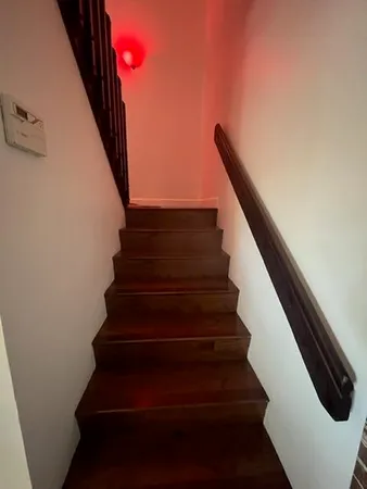 a bedroom with a bed and flat screen tv