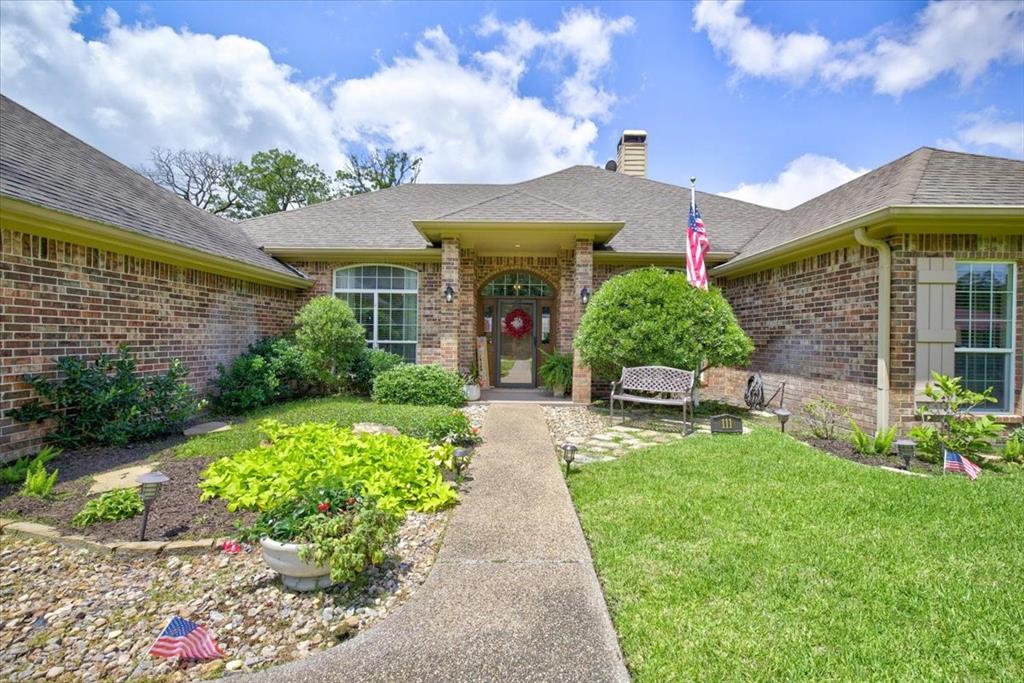 111 Trailwood Road Enchanted Oaks, TX 75156 - Photo 4 of 33 a front view of a house with a yard