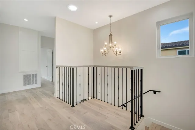 a view of a hallway with a chandelier