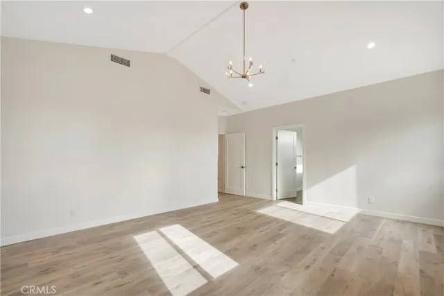 a bathroom with a double vanity sink mirror and bathtub