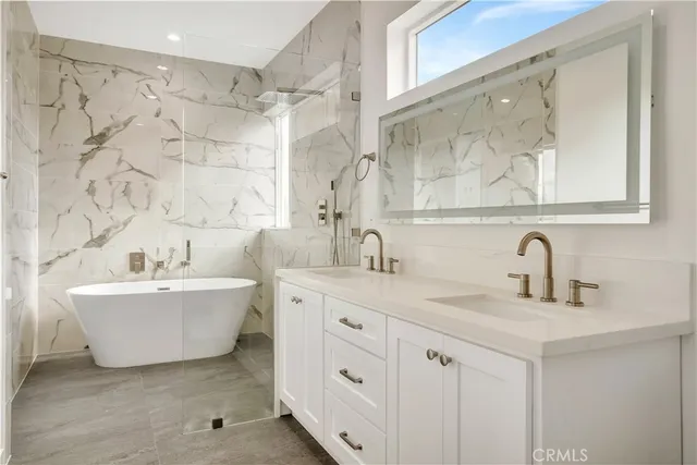 a bathroom with a bathtub and shower